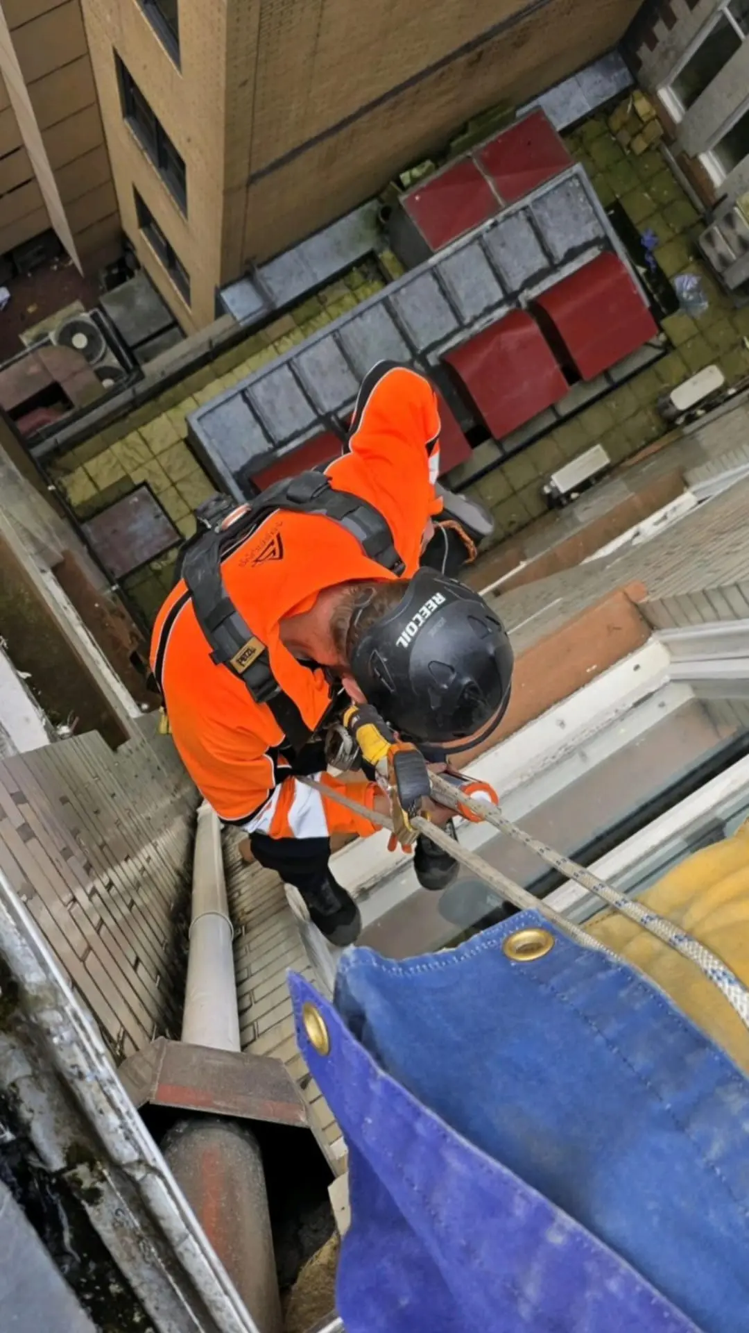 Engineer performing a structural inspection at height using rope access