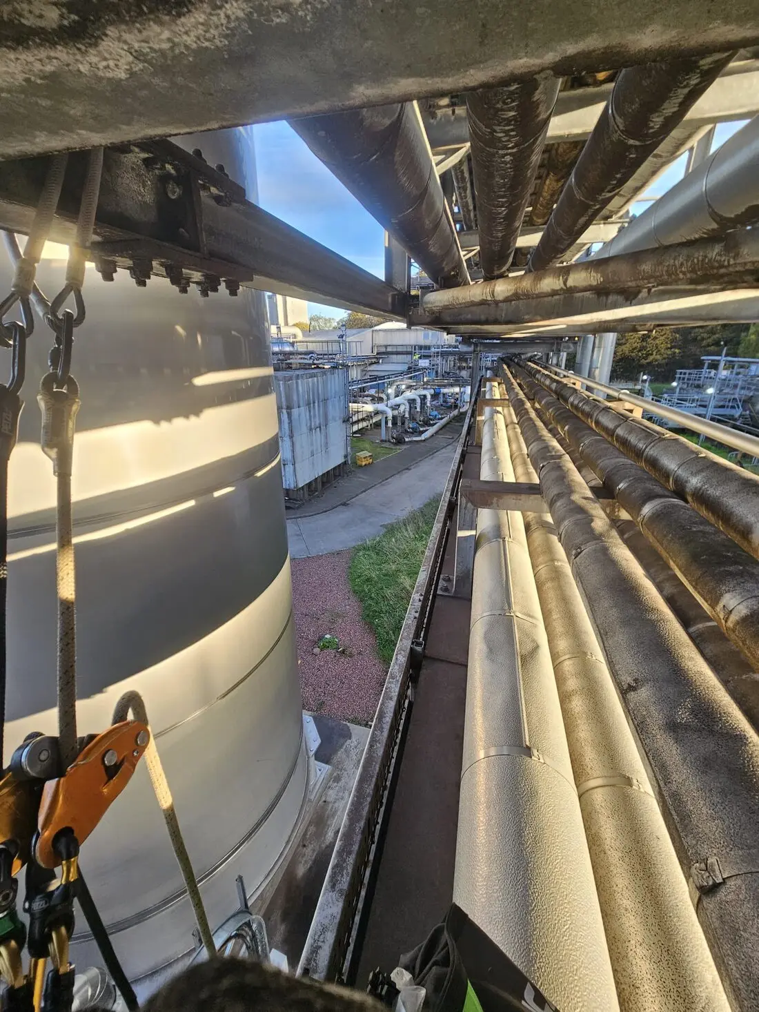 Rope access worker wearing full safety equipment