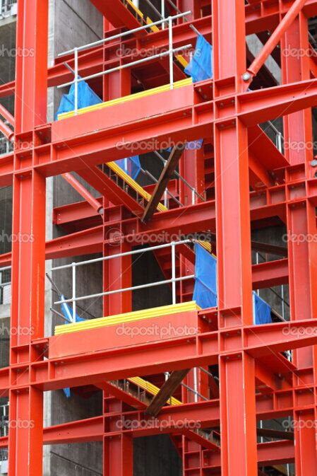Rope access painter applying coating to high-level steelwork