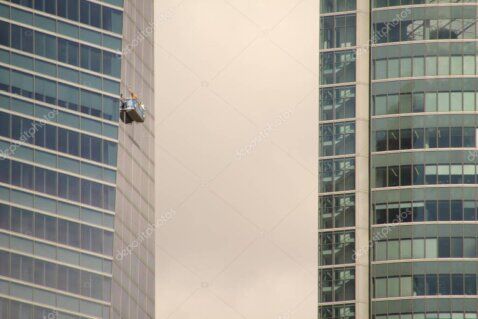 City buildings with rope access maintenance in progress