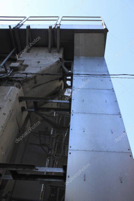 Rope access technician carrying out a structural inspection at height