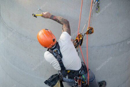 Rope access team carrying out an inspection on an industrial structure